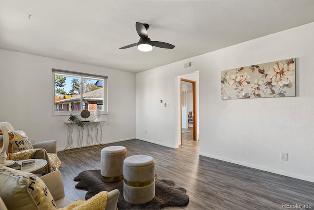 295 E Amherst Ave, Englewood, CO 80113 - living room featuring dark wood-style floors, ceiling fan, and baseboards