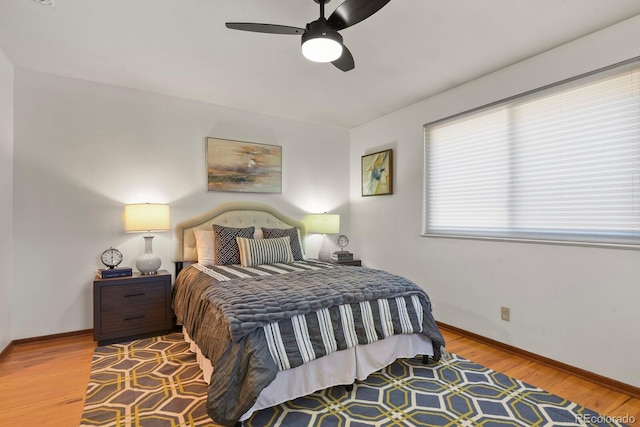 295 E Amherst Ave, Englewood, CO 80113 - bedroom featuring baseboards, wood finished floors, and ceiling fan