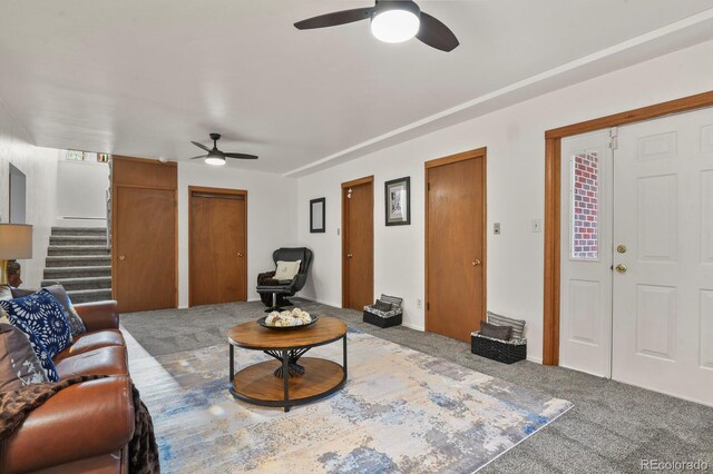 295 E Amherst Ave, Englewood, CO 80113 - living room featuring ceiling fan, stairway, and carpet