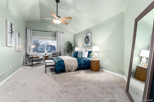 carpeted bedroom with vaulted ceiling, baseboards, and ceiling fan