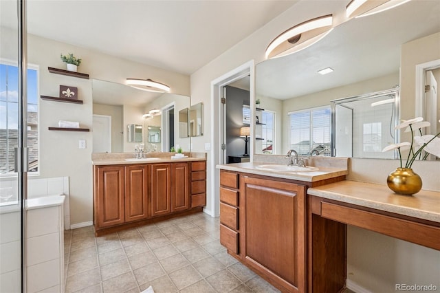 6723 Silverwind Cir, Colorado Springs, CO 80923 - bathroom featuring a shower stall, two vanities, and tile patterned flooring