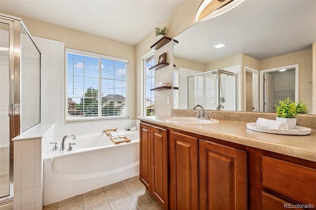 6723 Silverwind Cir, Colorado Springs, CO 80923 - full bath featuring a stall shower, a bath, vanity, and tile patterned floors