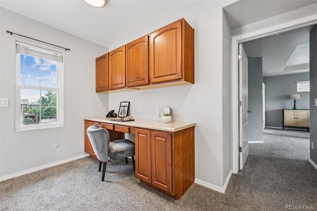 6723 Silverwind Cir, Colorado Springs, CO 80923 - carpeted home office with built in study area and baseboards