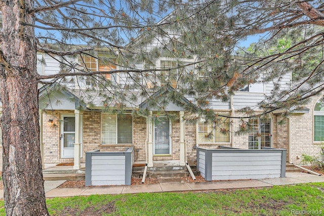 1121 W 112th Ave Unit C, Denver, CO 80234 - rear view of house with brick siding