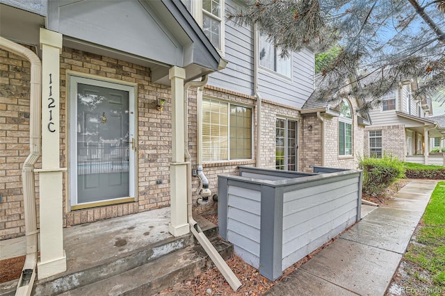 1121 W 112th Ave Unit C, Denver, CO 80234 - entrance to property with brick siding and a porch