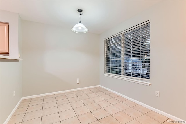 1121 W 112th Ave Unit C, Denver, CO 80234 - unfurnished dining area featuring baseboards