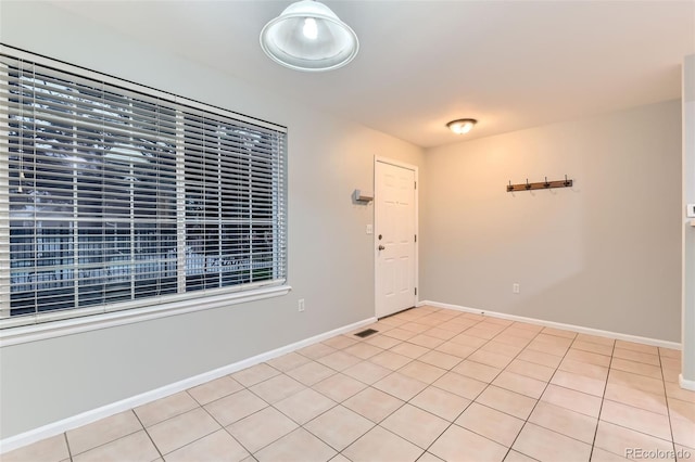 1121 W 112th Ave Unit C, Denver, CO 80234 - empty room with baseboards and light tile patterned flooring