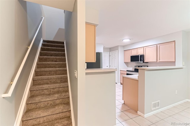 1121 W 112th Ave Unit C, Denver, CO 80234 - stairway featuring tile patterned floors and recessed lighting