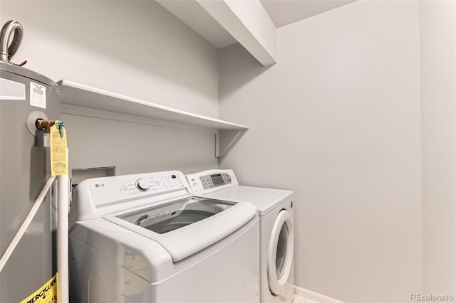 1121 W 112th Ave Unit C, Denver, CO 80234 - laundry area with washer and clothes dryer and water heater
