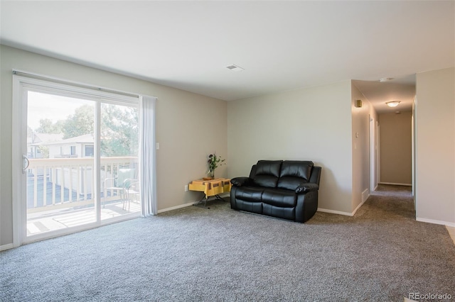 living area with carpet flooring