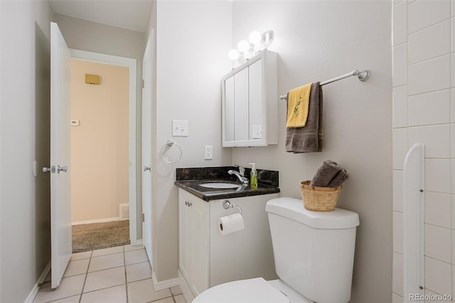 bathroom with tile patterned floors, vanity, and toilet