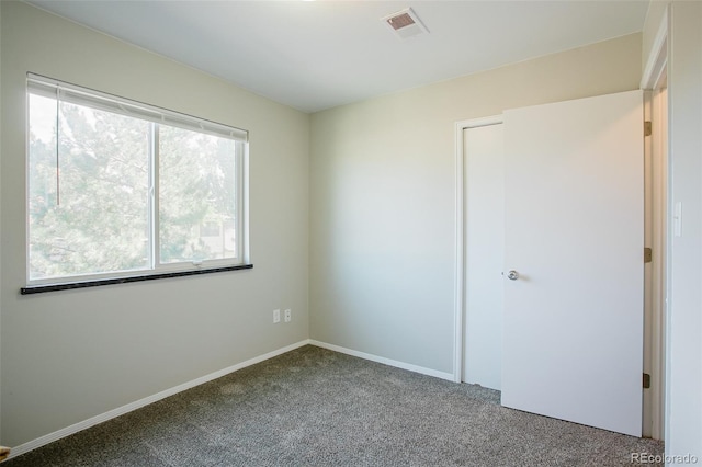 unfurnished bedroom with carpet flooring