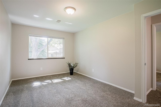 unfurnished room featuring carpet floors