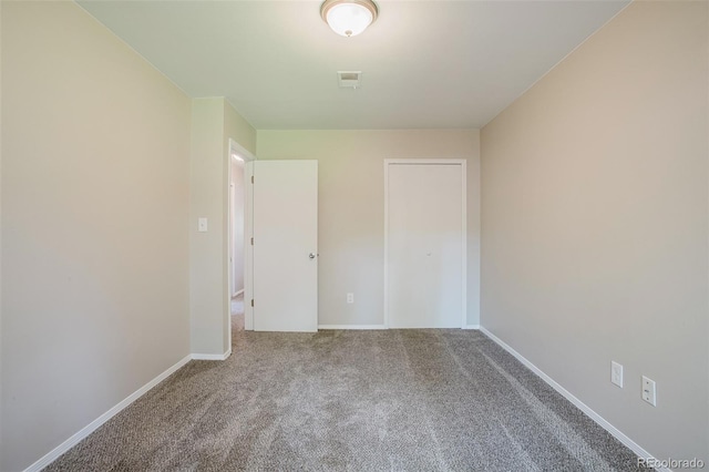 unfurnished bedroom featuring carpet