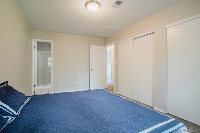 unfurnished bedroom featuring carpet and ensuite bath