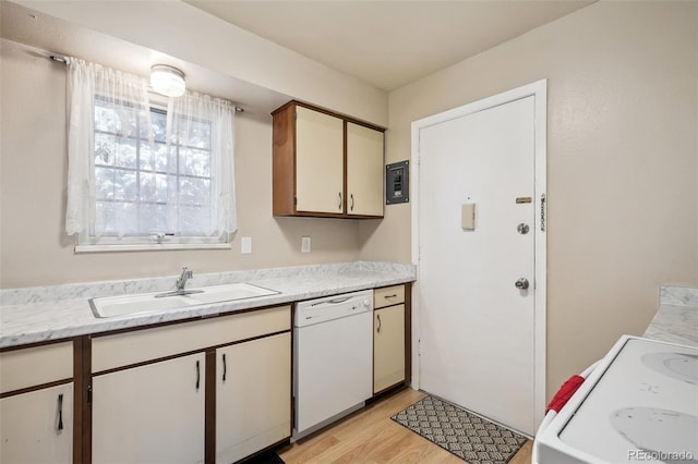 kitchen featuring electric range oven, sink, dishwasher, and light wood-type flooring