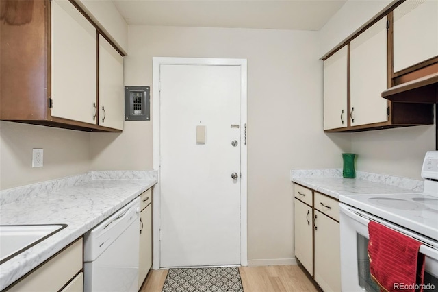 kitchen featuring white appliances, white cabinets, electric panel, and light stone countertops