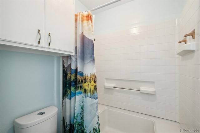 bathroom featuring shower / bath combination with curtain and toilet