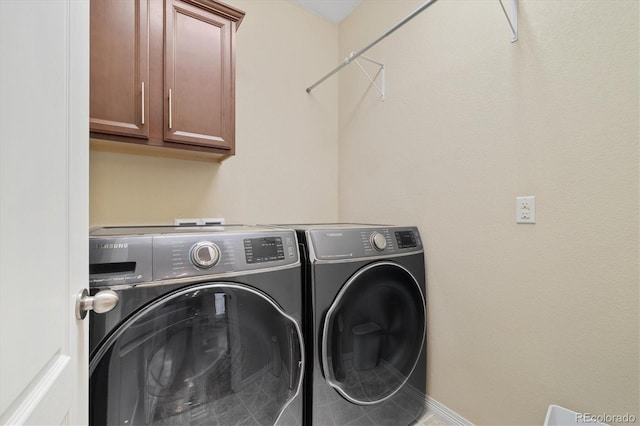 25811 E Archer Ave, Aurora, CO 80018 - washroom with cabinet space, independent washer and dryer, and baseboards