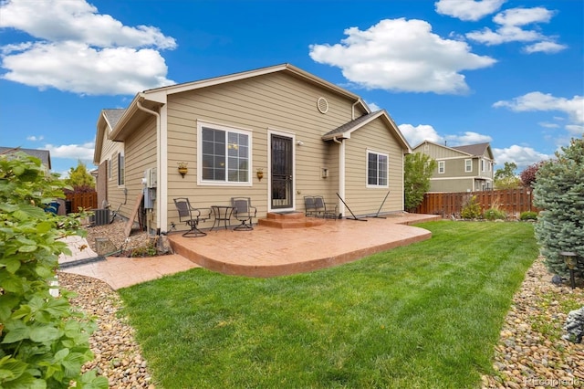 25811 E Archer Ave, Aurora, CO 80018 - rear view of house with a patio area and central air condition unit