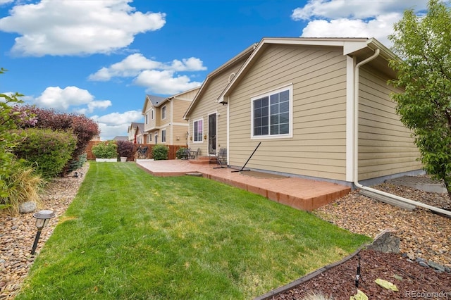 25811 E Archer Ave, Aurora, CO 80018 - back of property with a patio area and a yard