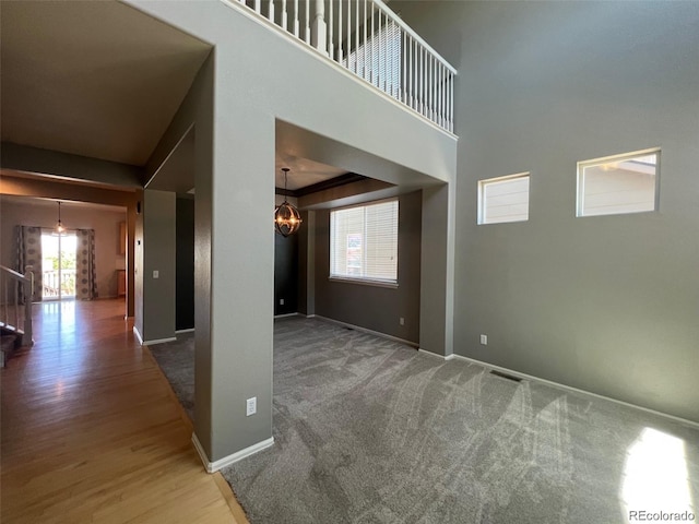 interior space featuring a notable chandelier and wood-type flooring