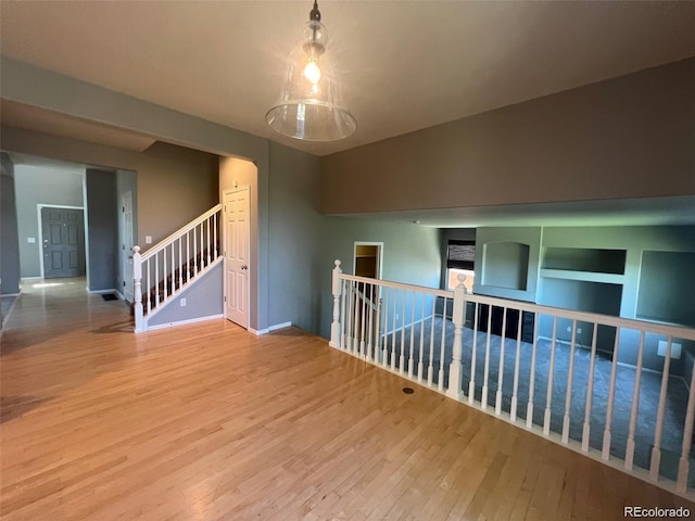 unfurnished room featuring hardwood / wood-style flooring