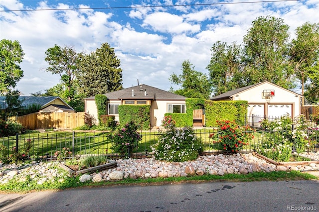 1060 S Eaton St, Lakewood, CO 80226 - ranch-style home with a vegetable garden, stucco siding, and a garage