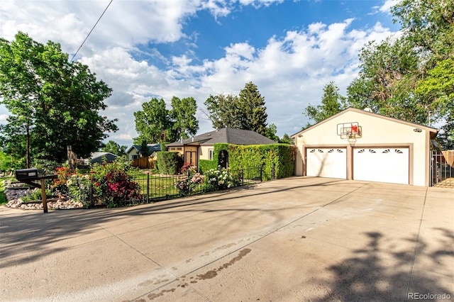 1060 S Eaton St, Lakewood, CO 80226 - view of front of property featuring stucco siding and an outdoor structure
