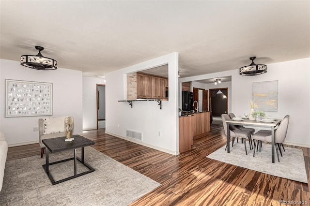 1060 S Eaton St, Lakewood, CO 80226 - living area with dark wood-style floors and a ceiling fan