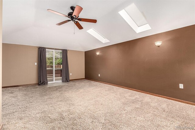 1060 S Eaton St, Lakewood, CO 80226 - unfurnished room with a skylight, lofted ceiling, ceiling fan, and carpet