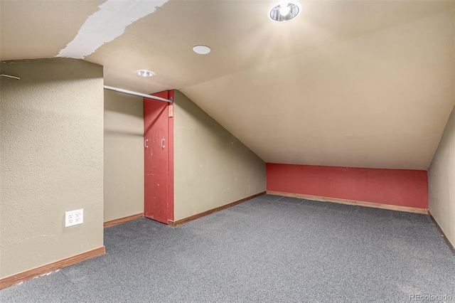 1060 S Eaton St, Lakewood, CO 80226 - additional living space featuring carpet floors and lofted ceiling