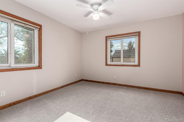1060 S Eaton St, Lakewood, CO 80226 - carpeted spare room with baseboards and ceiling fan