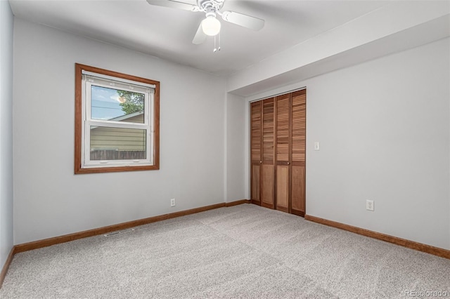 1060 S Eaton St, Lakewood, CO 80226 - unfurnished bedroom featuring carpet, a closet, and a ceiling fan