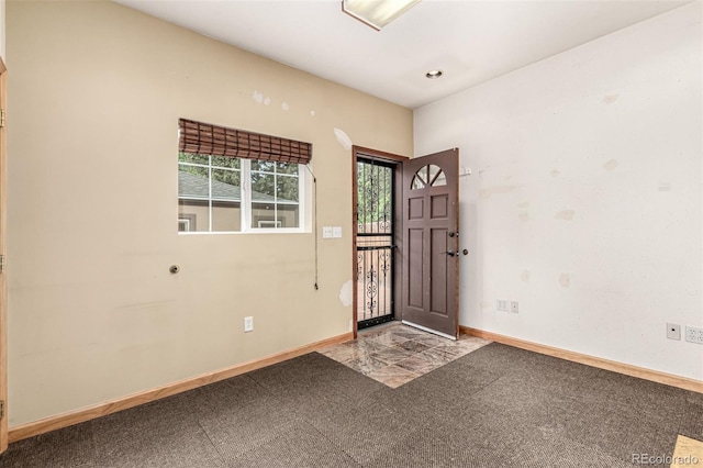 1060 S Eaton St, Lakewood, CO 80226 - carpeted foyer featuring baseboards