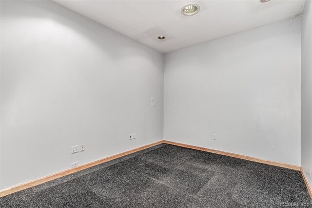 1060 S Eaton St, Lakewood, CO 80226 - carpeted spare room featuring baseboards