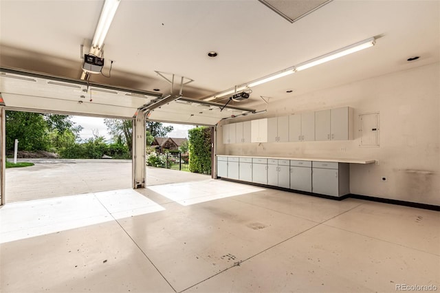 1060 S Eaton St, Lakewood, CO 80226 - garage featuring a garage door opener and electric panel