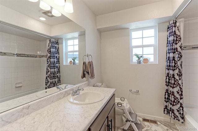 full bathroom with vanity, toilet, and shower / tub combo with curtain