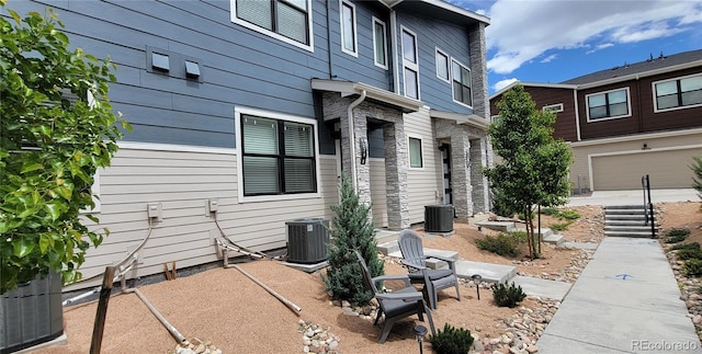 9279 Merino Ct Unit B, Littleton, CO 80125 - view of side of home with cooling unit and stone siding