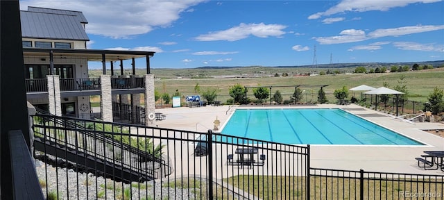 9279 Merino Ct Unit B, Littleton, CO 80125 - community pool with a patio area and a rural view