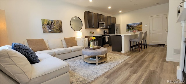 9279 Merino Ct Unit B, Littleton, CO 80125 - living area featuring light wood-style floors and recessed lighting