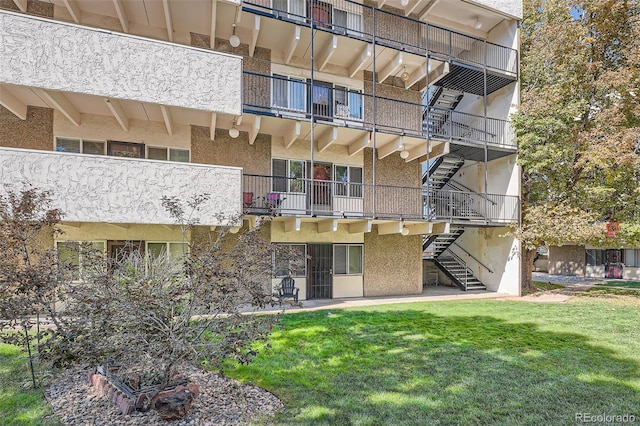 384 S Ironton St Unit 201, Aurora, CO 80012 - view of apartment building / complex featuring stairway