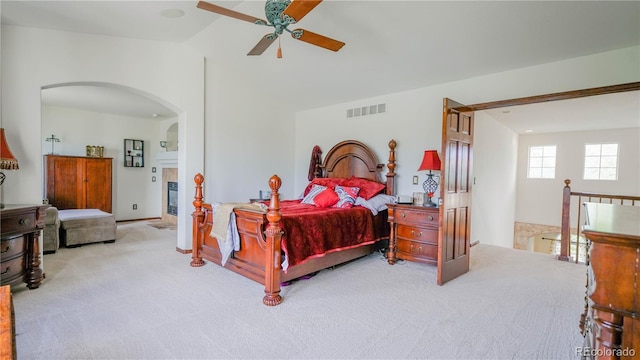 9832 N Crystal Lake Dr, Littleton, CO 80125 - bedroom featuring carpet, arched walkways, lofted ceiling, and ceiling fan