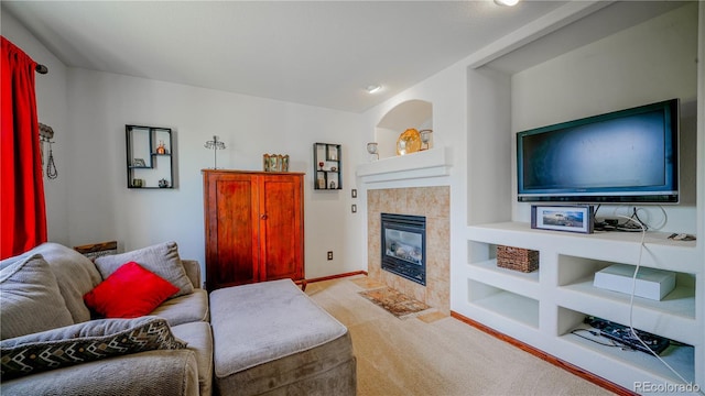 9832 N Crystal Lake Dr, Littleton, CO 80125 - living area featuring carpet flooring, a tile fireplace, and baseboards