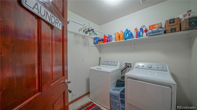 9832 N Crystal Lake Dr, Littleton, CO 80125 - laundry room with washing machine and dryer and baseboards