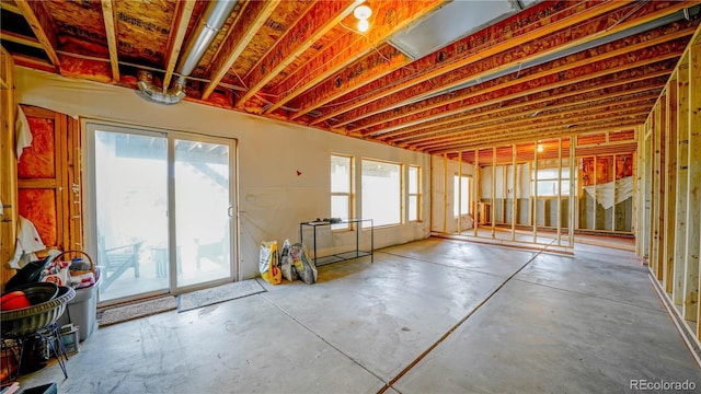 9832 N Crystal Lake Dr, Littleton, CO 80125 - miscellaneous room featuring concrete floors and healthy amount of natural light