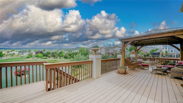 9832 N Crystal Lake Dr, Littleton, CO 80125 - wooden deck featuring a gazebo and a residential view