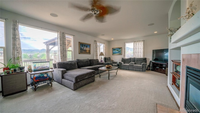 9832 N Crystal Lake Dr, Littleton, CO 80125 - living room with light colored carpet, ceiling fan, and recessed lighting