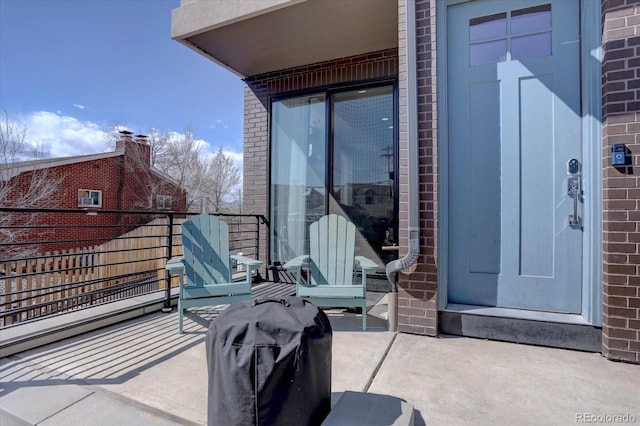 view of patio / terrace with a balcony and grilling area