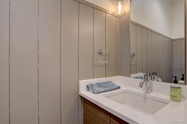 bathroom with vanity and wainscoting